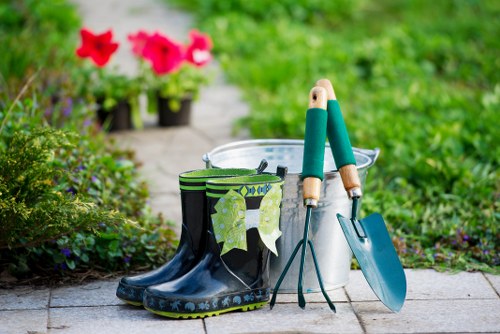 Workers using protective clothing and safety gear during landscaping tasks