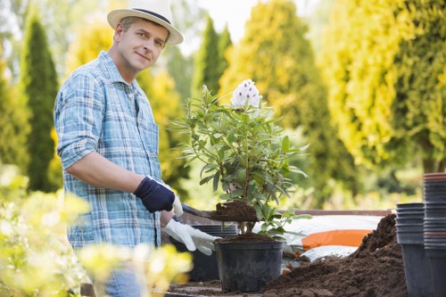 Insured landscaping service preparing tools and equipment for a project