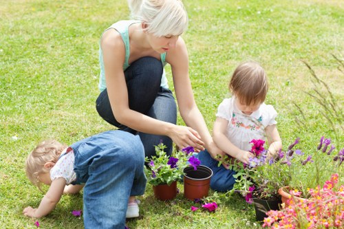 Kentishtown landscape design with hardscaping, plants, and outdoor seating areas